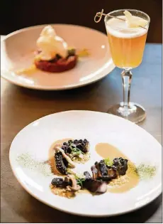  ?? CONTRIBUTE­D BY MIA YAKEL ?? Noona in Duluth is a steak house and oyster bar with a menu that melds Korean flavors. The grilled octopus with glazed shimeji mushrooms incorporat­es fermented soybean, panko, ssamjang, seaweed powder and smoked black sesame.