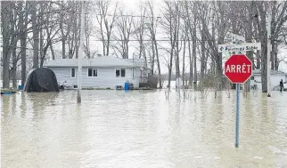  ?? GRAHAM HUGHES/THE CANADIAN PRESS ?? There have been four cases of carbon monoxide poisoning since the flooding began, and the city’s public health director says it’s likely there will be instances of gastroente­ritis.