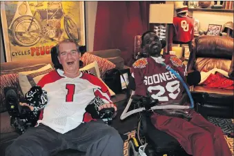  ?? [PHOTOS BY JOE MUSSATTO/ THE OKLAHOMAN] ?? Former Oklahoma defensive back Rickey Dixon, right, spent time with Sooner fan Steve Dolman on Sunday. The OU alums watched the second half of the Sooners' game together. Both Dixon and Dolman have ALS.