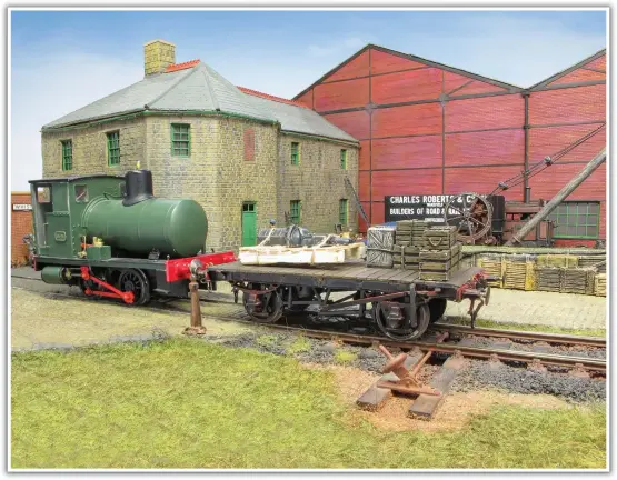  ??  ?? A fireless locomotive waits next to the office building. These locomotive­s ran on compressed air and the model has been made from an Eric Underhill kit.