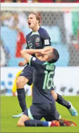  ?? REUTERS ?? Australia's Jackson Irvine and Aziz Behich celebrate after beating Tunisia on Saturday.