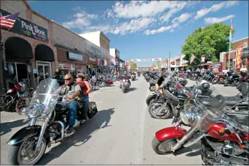  ??  ?? Thousands of bikers ride through the streets for the opening day of the 80th annual Sturgis Motorcycle rally Friday in Sturgis, S.D. (AP Photo/Stephen Groves)