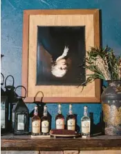  ?? KRISTIAN THACKER/THE NEW YORK TIMES 2022 ?? A portrait of Alexander Hamilton is hung upside-down at Mingo Creek Craft Distillers in Washington, Pennsylvan­ia.