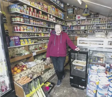  ?? ?? INDEPENDEN­T TRADING: May Stocks has been running her shop at Colden above Hebden Bridge for half a century and has expanded the business over the years. Pictures: Lee McLean/SWNS
