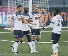  ??  ?? HEADING THROUGH Bedsente Gomis’, centre, header took the Hawks to a first-round triumph over Cray Valley PM