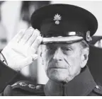  ?? AP/PAUL edwards ?? Britain’s Prince Philip salutes during a special Armistice Day ceremony under the Menin Gate in Ypres, Belgium, in this photo taken on november 11, 2013. the Duke of edinburgh attended a special Armistice Day ceremony to oversee the handover of 70 sandbags of soil from Flanders fields.