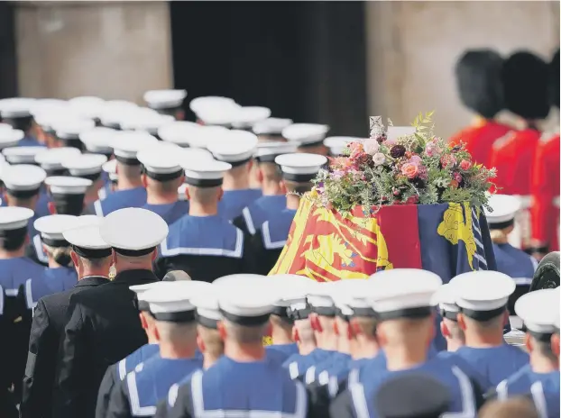  ?? ?? The State Gun Carriage carries the coffin of Queen Elizabeth II, draped in the Royal Standard.