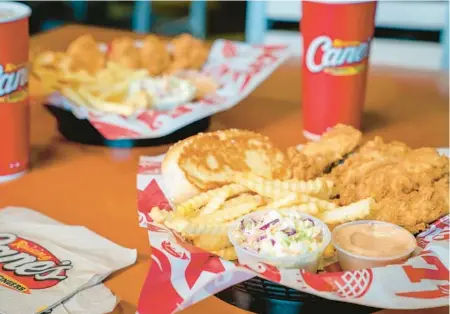  ?? COURTESY ?? Raising Cane’s, which offers chicken tenders, crinkle-cut fires and coleslaw, is planning to open four South Florida locations by this summer, starting with Boynton Beach in April.