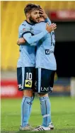  ??  ?? Milos Ninkovic and Brandon O’Neill of Sydney FC celebrate their win.