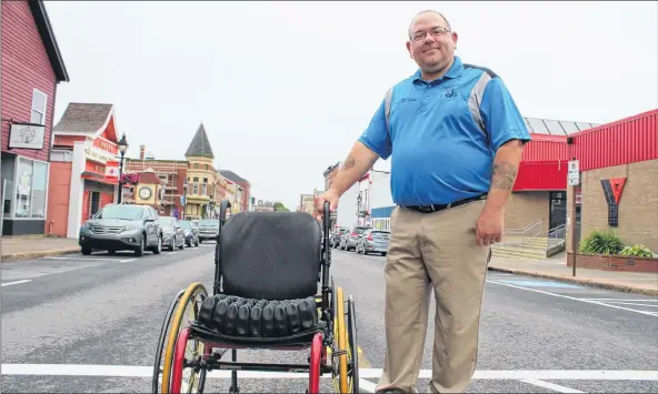  ?? CARLA ALLEN ?? Podiatrist Michael Innis, owner of Happy Feet Orthotics on Main Street, has issued a challenge to Town of Yarmouth officials to check into various locations around town while using a wheelchair for eight hours and only public transit.