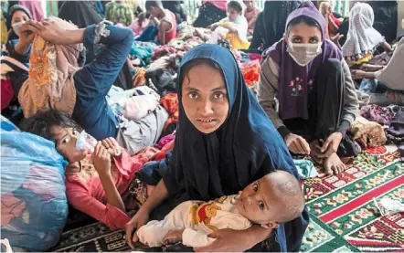  ?? ?? Safer ground: The rohingya at a shelter after they were found along the coast near north aceh. — ap