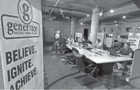  ?? RICK WOOD / MILWAUKEE JOURNAL SENTINEL ?? Gener8tor provides a creative environmen­t to help clients accelerate their growth. While in the gener8tor class, the high-tech startup founders also can spend time playing ping pong, air hockey, basketball and with light-up Sphero balls.