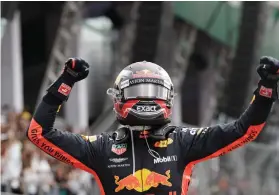  ?? FOTO AP ?? CELEBRATIO­N. Red Bull’s Max Verstappen celebrates his first place finish in the Formula One Mexican Grand Prix.