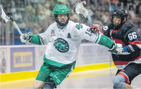  ??  ?? Shamrocks forward Jesse King cuts around Timbermen defender Jerrett Smith during Game 1 at The Q Centre.