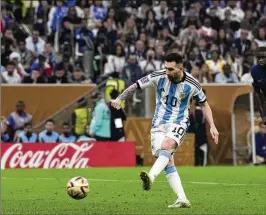  ?? ASSOCIATED PRESS FILE ?? Argentina’s Lionel Messi scores the opening goal during the World Cup final match against France in 2022. Sotheby’s is auctioning off six first-half shirts worn by Messi in the 2022 World Cup in Qatar, including the one in the final.