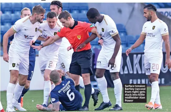  ??  ?? Surface tension: Bartley (second from right) gets stuck into Killie midfielder Alan Power