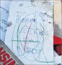  ?? SALTWIRE NETWORK PHOTO ?? A card that says “Happy Veterans Day Daddy” is among the personal possession­s Coxheath, N.S., resident Steve Smith recovered from a sailboat that is stranded on the rocky shores of Cape Breton.