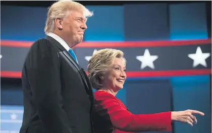  ?? Picture / AP ?? Donald Trump and Hillary Clinton meet in the first face-to-face debate of the US presidenti­al campaign.