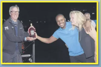  ?? ?? Kamal Powell (center), Regional Marketing Manager Appleton Estate and Lynda Langford, Pineapple Cup representa­tive welcome Jim Murray to Jamaica’s shores with an Appleton Estate 12 Year Old Rare Casks.