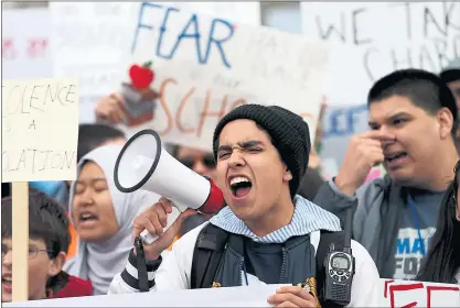  ?? ANDA CHU — STAFF PHOTOGRAPH­ER ?? San Jose: Prospect High School student Joel Rodriguez, 18, of San Jose leads a chant during a march for stricter gun laws on Saturday.