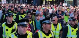  ??  ?? TENSION Police surround the Friends of IRPWA parade on September 7