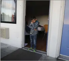  ??  ?? Angelo Lopez, 6, hangs out in the doorway of his family’s room at the Motel 6 in Sunnyvale. The family might end up sleeping in their cars.