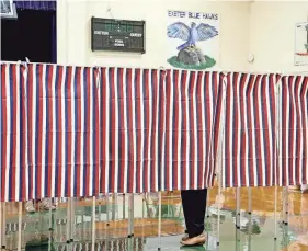  ?? OLIVIA FALCIGNO/PORTSMOUTH HERALD ?? Voters are seen at the polls at Talbot Gym on Sept. 13, 2022 during the New Hampshire primary in Exeter.