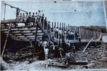  ?? ?? A historic photo shows workers building World War I merchant ships on docks near the Port of Beaumont.