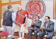  ?? PTI PHOTO ?? PM Modi shakes hands with the chairman of NSCN-IM, Isak Chishi Swu, at the signing ceremony of the peace accord between India and NSCN on Monday.