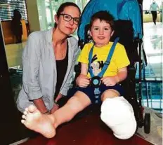  ?? Virendra Saklani/Gulf News ?? Stanley with his mother Helen Wood. On February 14, his rubber footwear (left) got caught in the edge of an escalator at a hotel in Dubai.