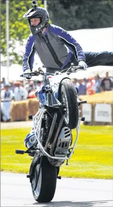  ?? Picture: Chris Bird/Getty Images ?? KEEP YOUR EYES ON THE ROAD: Mattie Griffin, of Ireland, looks towards the watching crowd as he performs wild runs on the hill climb with his BMW F800R during the Goodwood Festival of Speed at Goodwood House in Chichester.