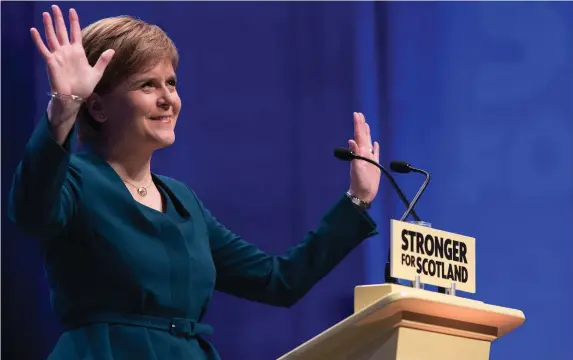  ??  ?? First Minister of Scotland and SNP leader Nicola Sturgeon speaks as the SNP’s biggest-ever conference began in Glasgow. Ms Sturgeon announced legislatio­n would be published next week which would allow a second referendum on Scottish independen­ce....