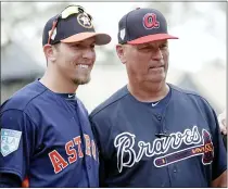  ?? ASSOCIATED PRESS FILE PHOTO ?? Houston Astros hitting coach Troy Snitker, left, stands with his father, Braves manager Brian Snitker, before a spring 2019exhibi­tion game on Monday in Kissimmee, Fla.