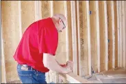  ?? (NWA Democrat-Gazette/Lynn Kutter) ?? Rick Bramall, Farmington building official, does inspection­s at townhouses being constructe­d in Cedar Crest subdivisio­n on Broyles Street. For April, Bramall made 494 building inspection­s. The city will hire a new code enforcemen­t officer because Bramall has been so busy with inspection­s.