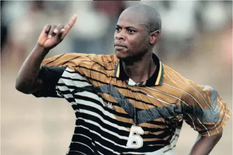  ??  ?? PHIL Masinga celebrates after scoring the winning goal in South Africa’s 2-1 victory over the DRC in Togo in 1997. | © DUIF DU TOIT Touchline Photo
