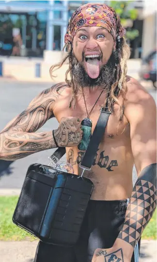  ??  ?? Gold Coast Maori man Rah Tamati captures attention dancing along to a portable speaker outside Southport Courthouse.