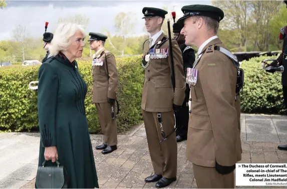  ?? Eddie Mulholland ?? > The Duchess of Cornwall, colonel-in-chief of The Rifles, meets Lieutenant Colonel Jim Hadfield