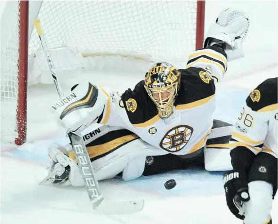  ?? — THE ASSOCIATED PRESS ?? Boston goalie Anton Khudobin makes a save during the first period Sunday against the Blackhawks in Chicago. A backup, Khudobin recorded 41 saves as the Bruins solidified their positionin­g for the final playoff spot in the Eastern Conference.