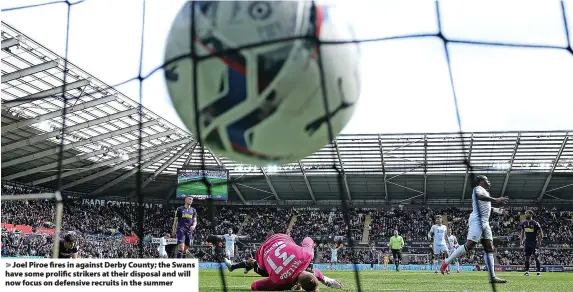  ?? ?? Joel Piroe fires in against Derby County; the Swans have some prolific strikers at their disposal and will now focus on defensive recruits in the summer