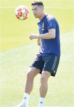  ??  ?? Ronaldo during training at the Juventus Training Centre in Turin, Italy. — Reuters photo