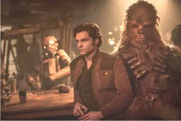  ??  ?? Ehrenreich and Joonas Suotamo star in ‘Solo’. — Courtesy of Disney-Lucasfilm