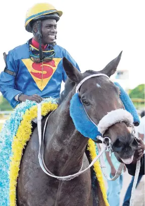  ?? FILE ?? Linton Steadman aboard BIGDADDYKO­OL after winning last year’s running of the Burger King Superstake­s race at Caymanas Park.