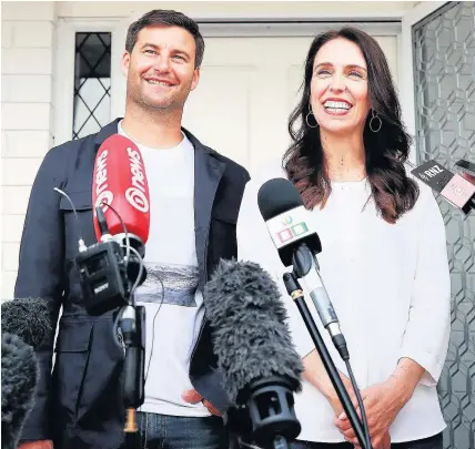  ??  ?? > Prime Minister Jacinda Ardern and her partner Clarke Gayford speak to the media in Auckland, New Zealand, after the announceme­nt that they are expecting their first child – Deputy Prime Minister Winston Peters will take on prime ministeria­l duties...