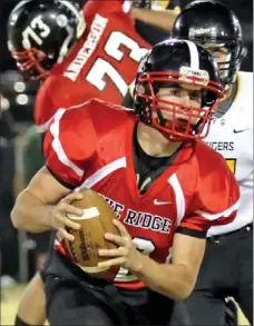  ?? Photograph courtesy of Russ Wilson ?? Blackhawk quarterbac­k Austin Easterling turns back for a pass during Friday night’s game against Prairie Grove.