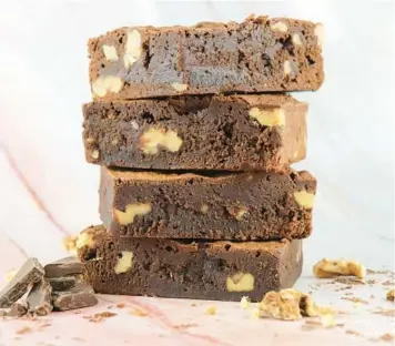  ?? DG DOUGHNUTS ?? DG Doughnuts’ German chocolate brownies are a cult favorite with fans of this signature cake.