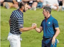  ?? ALASTAIR GRANT THE ASSOCIATED PRESS FILE PHOTO ?? Rory McIlroy, right, and Dustin Johnson, left, play Rickie Fowler and Matthew Wolff to raise bucks for COVID-19 relief Sunday.