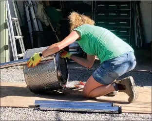  ??  ?? A NEW SPIN: Kate turns her washing machine drum into a firepit