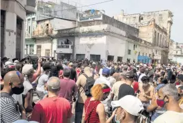  ?? ISMAEL FRANCISCO AP ?? Anti-government demonstrat­ors march in Havana, Cuba, on July 11, 2021. Many were given harsh prison sentences.