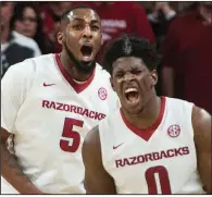  ?? NWA Democrat-Gazette/CHARLIE KAIJO ?? Arkansas senior forward
Arlando Cook (left) has had his ups and downs during his Razorbacks’ career, but he’s on schedule to graduate with a sociology degree in May. “Everybody goes through different trials and tribulatio­ns in their life. That...