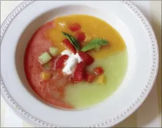  ?? SARA MOULTON, THE ASSOCIATED PRESS ?? This soup’s blazing good looks — a kaleidosco­pe of red, yellow and green — result from the fact that each of the three purées keeps to itself.